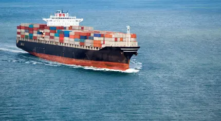 A maritime offshore oil rig in the middle of the ocean.