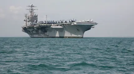 A military ship in the middle of the ocean.